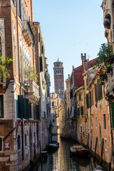 Fototapeta na wymiar Italy, Venice, Italy, VIEW OF CANAL AMIDST BUILDINGS IN CITY