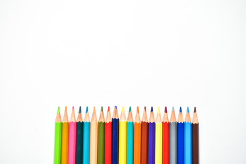 Multi - colored pencils, children's creativity, drawing colorful bright pencils on white background