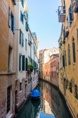 Fototapeta na wymiar Italy, Venice, Italy, CANAL AMIDST BUILDINGS AGAINST SKY IN CITY