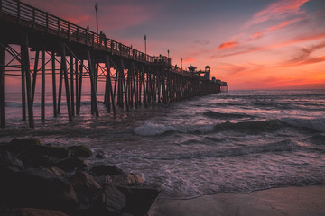 sunset and pier on the beach