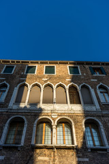 Fototapeta premium Italy, Venice, Venice, LOW ANGLE VIEW OF BUILDING AGAINST CLEAR BLUE SKY