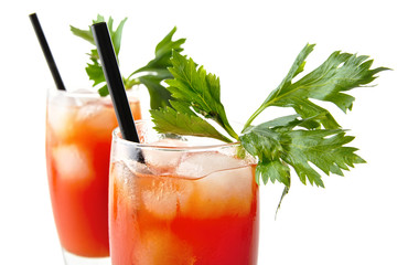 Close-up bloody mary with ice cubes with celery on white from above