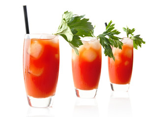 Three Bloody Mary with ice cubes with celery isolated on white