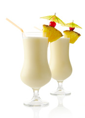 Pina colada coconut cocktails with ice on white background