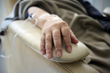 Buenos Aires, Argentina - March 08, 2019: Unidentified hand connected to a chemotherapy treatment in Buenos Aires, Argentina