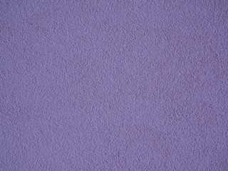 Rough violet / purple painted concrete wall, stucco texture