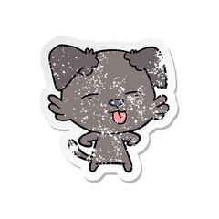 distressed sticker of a cartoon dog sticking out tongue