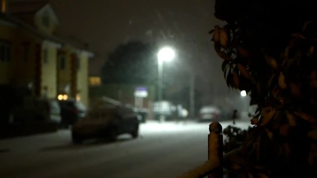 Snow falling on streets of Epsom, Surrey, Uk at night, winter scenic. Febr. 2018