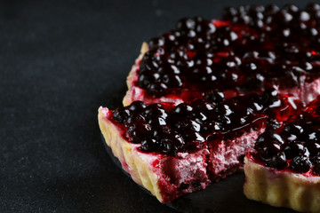 tart with blackberry on dark background sliced pie with berries