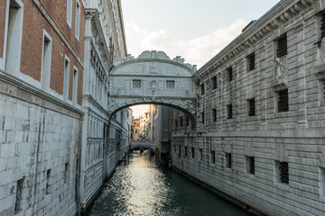 Italy, Venice, Bridge of Sighs, a close up of a stone building with Bridge of Sighs in the background