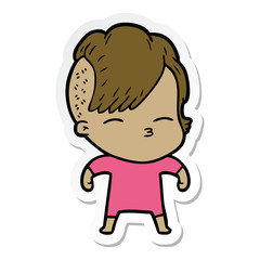 sticker of a cartoon squinting girl