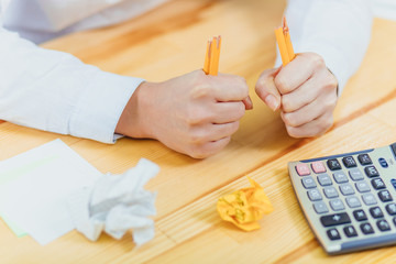 Hand with broken pencil and crumpled paper. Business frustrations, Job stress and Failed exam concept.