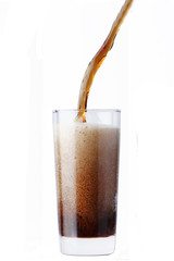 cola pouring in glass isolated on white background