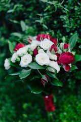 Very beautiful bridal bouquet on green grass.