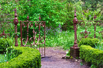 English garden with wrought iron gate