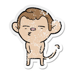 distressed sticker of a cartoon suspicious monkey
