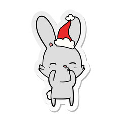 curious bunny sticker cartoon of a wearing santa hat
