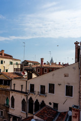 Fototapeta na wymiar Italy, Venice, a church with a clock on the side of a building