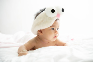 baby relax in a white bedroom. Family with children at home. Love, trust and tenderness.Concept of love and family