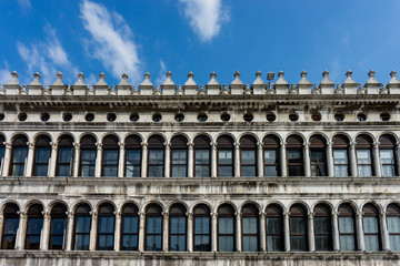 Fototapeta na wymiar Italy, Venice, Piazza San Marco, LOW ANGLE VIEW OF BUILDING AGAINST CLOUDY SKY