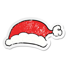 distressed sticker of a cartoon christmas hat