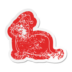 cartoon distressed sticker of a otter wearing santa hat