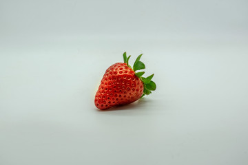 Fresh strawberry on a neutral shape