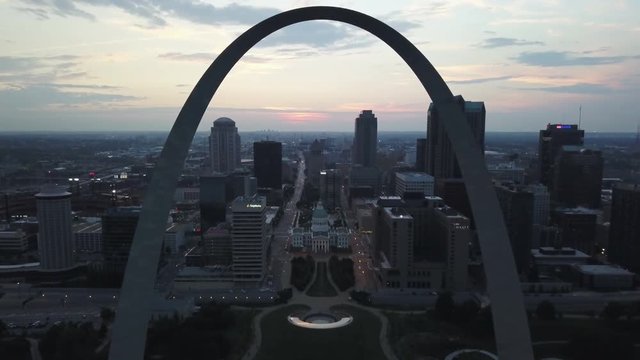 Aerial, the Gateway Arch overlooks St Louis, Missouri at dusk