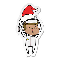 happy sticker cartoon of a astronaut wearing santa hat