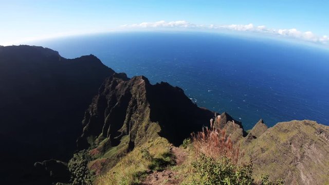 Mountains overlook water in Na Pali Coast State Park in Hawaii