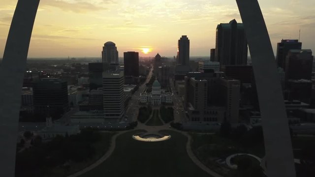 Aerial, view of St Louis, Missouri through the Gateway Arch at sunset