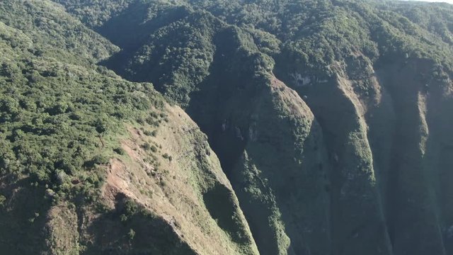 Aerial, green mountainside at Na Pali Coast State Park in Hawaii