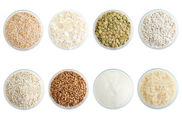 Different types of cereals in glassware. View from above. White isolate