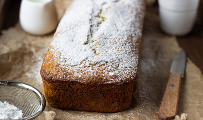 Homemade lemon poppy seed pound cake. Wooden background. Close up.