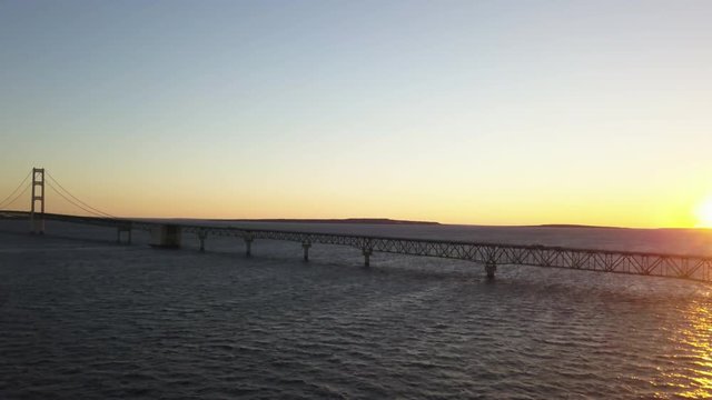 Bridge over the Great Lakes in Michigan at dusk, wide aerial