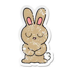 distressed sticker of a quirky hand drawn cartoon rabbit