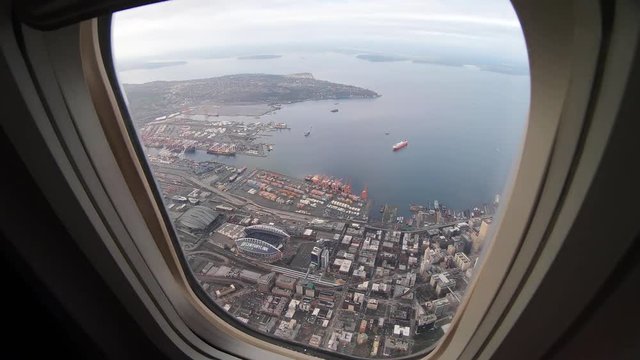 Timelapse, view of a city from airplane window