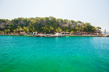 green, blue water on the coast of the beach, a resort for swimming