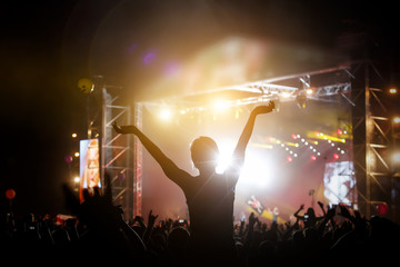 Silhouette of a happy man at the summer festival, good pastime