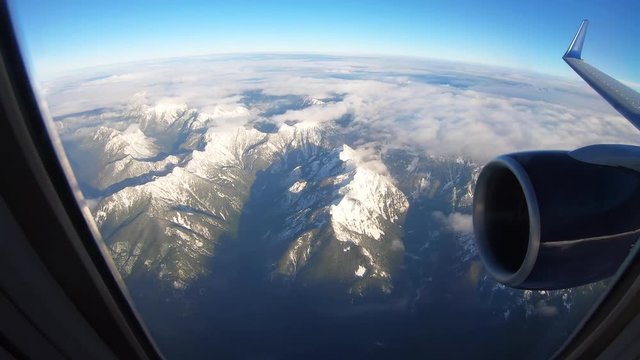 Timelapse, view of mountains from airplane window