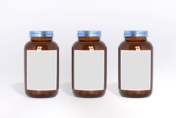 Blank glass medical bottles with tablets pills and label