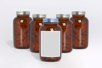 Blank glass medical bottles with tablets pills and label