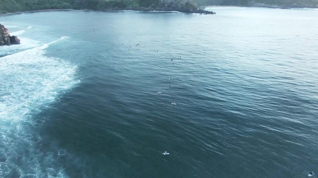 Surfers in water at Honokahua Bay, Hawaii, aerial