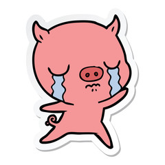 sticker of a cartoon pig crying