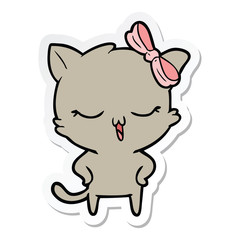sticker of a cartoon cat with bow on head and hands on hips