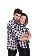 Happy young couple embracing each other isolated on white