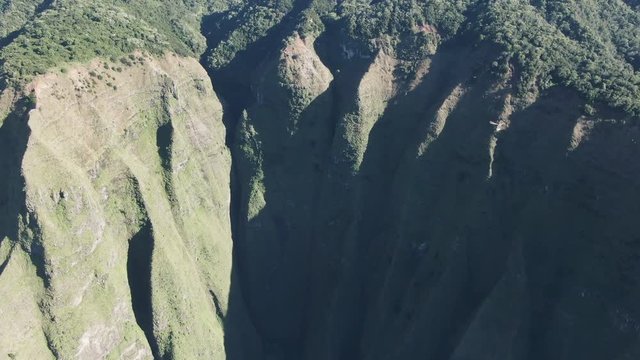 Aerial, bird flies over valley at Na Pali Coast State Park in Hawaii