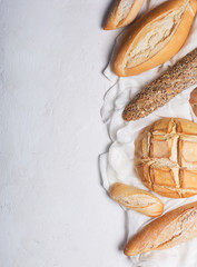 Fototapeta na wymiar Fresh bread on a white background. Top view with copy space