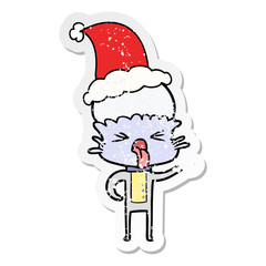 disgusted distressed sticker cartoon of a alien wearing santa hat