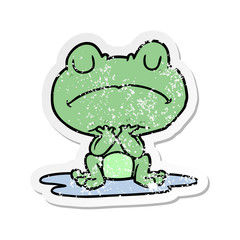 distressed sticker of a cartoon frog in puddle